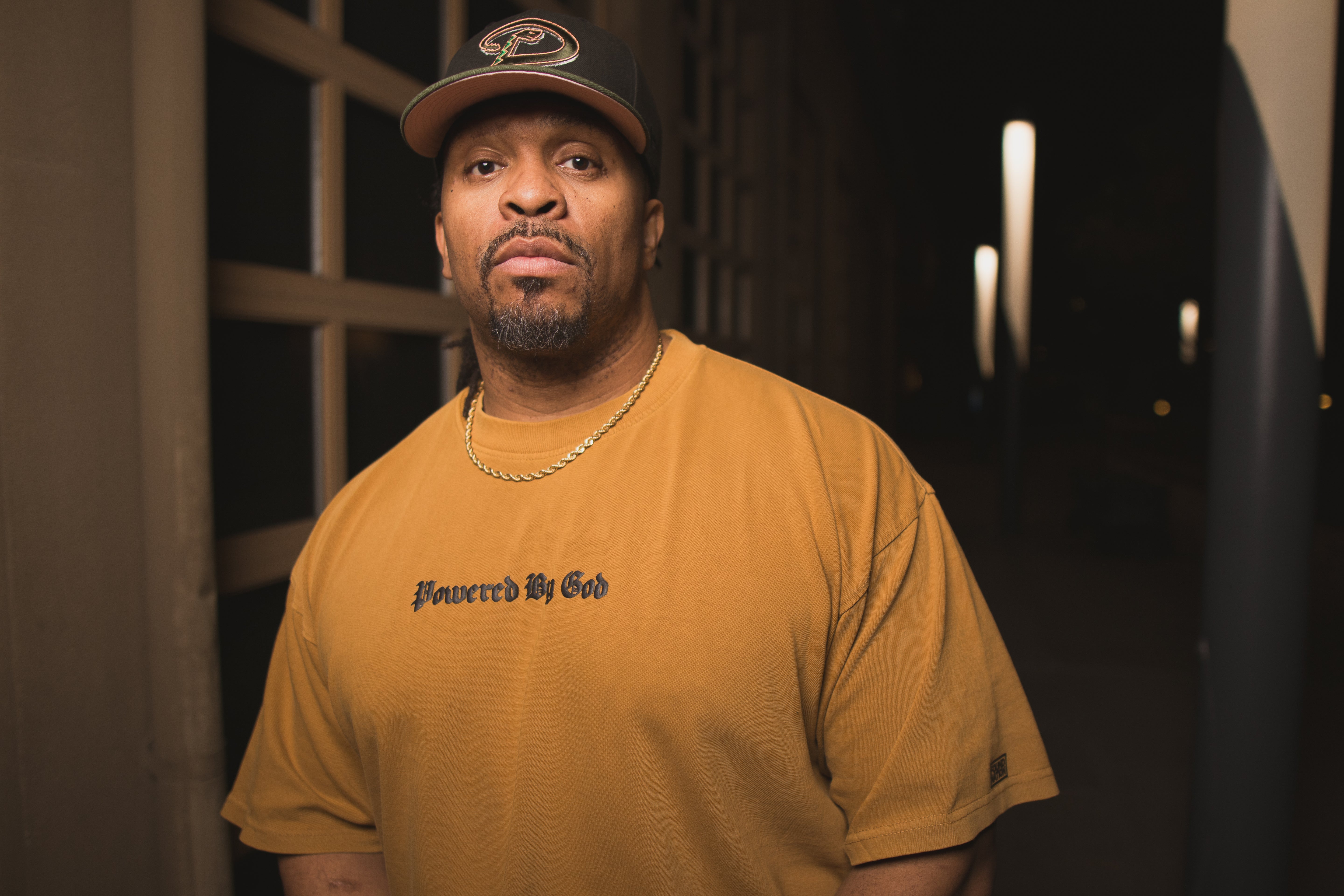 GOLD POWERED BY GOD TEE